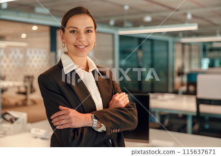 Portrait of a confident businesswoman in a modern office setting, exuding professionalism 115637671