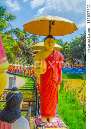 row of Buddhist monk statues in Dambulla row of Buddhist monk statues in Dambulla 115637892