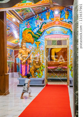 traditional Sri Lankan white temple stupas in evening. 115637901