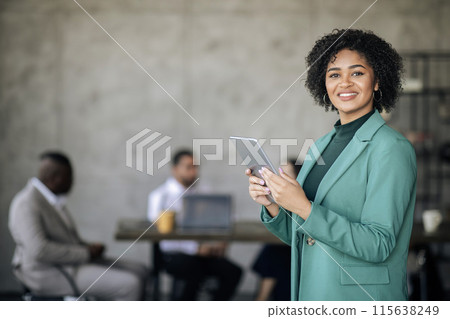 Online Business Offer. Happy African American Businesswoman Using Digital Tablet Smiling At Camera, Posing With Portable Computer In Modern Office. Free Space For Text Advertisement Online Business Offer. Happy African American Businesswoman Using Digital Tablet Smiling At Camera, Posing With Portable Computer In Modern Office. Free Space For Text Advertisement 115638249