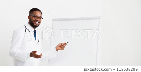 African Doctor Giving Lecture For Colleagues Using Whiteboard And Pictures 115638299