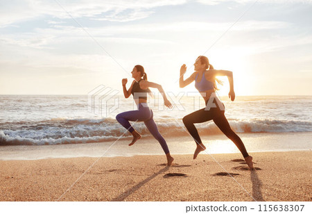 Smiling fast slim young caucasian women enjoy morning workout, running, freeze in air on sea beach. Competition, sports, active lifestyle and body care, weight loss outdoor Smiling fast slim young caucasian women enjoy morning workout, running, freeze in air on sea beach. Competition, sports, active lifestyle and body care, weight loss outdoor 115638307