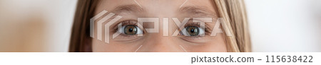 Closeup macro shot of human teenager girl green eyes, blurred background. Woman with natural face beauty makeup, web-banner. Pediatric ophthalmology, vision care in children concept 115638422