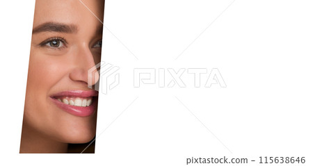 The image shows a woman face peeking through a perfectly circular hole in a white piece of paper. Her features are visible, framed by the edges of the hole. 115638646