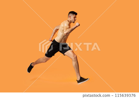A man in motion, running energetically on a vibrant orange background. His strides are powerful and determined, creating a sense of speed and urgency. A man in motion, running energetically on a vibrant orange background. His strides are powerful and determined, creating a sense of speed and urgency. 115639376