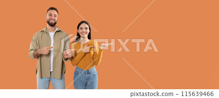A man and a woman are standing next to each other in this scene. They are both looking ahead, with the woman slightly leaning towards the man, pointing at empty space A man and a woman are standing next to each other in this scene. They are both looking ahead, with the woman slightly leaning towards the man, pointing at empty space 115639466