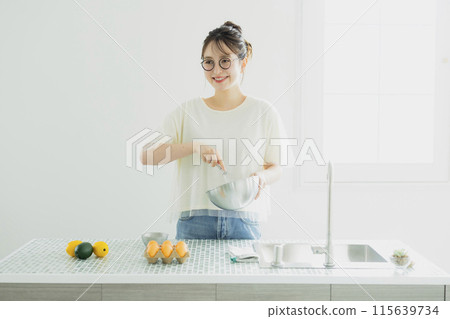 Woman in the kitchen Woman in the kitchen 115639734