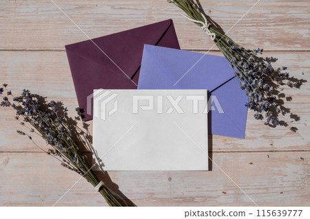 Empty white envelope paper card note template mock up. Copy space for your text. Lavender flower. Greeting or invitation card blank with envelope. Top view 115639777
