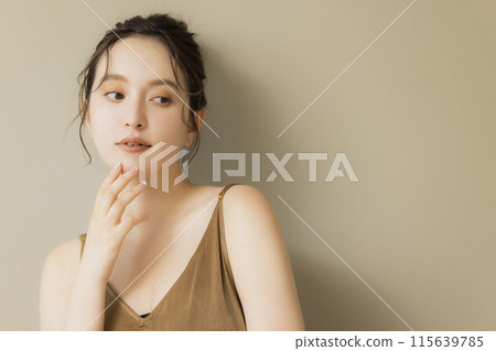 Young woman beauty image beige background Young woman beauty image beige background 115639785