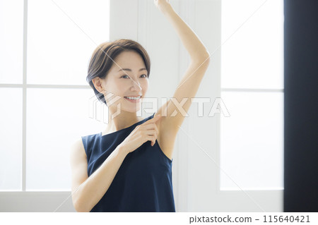 Middle-aged woman doing body care 115640421