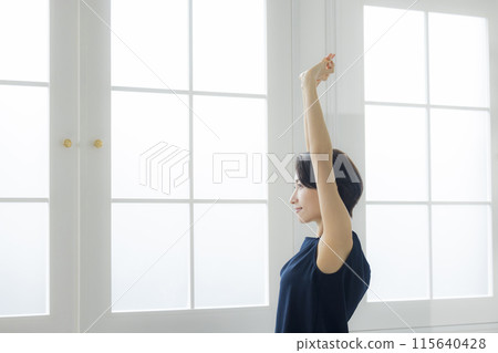 Middle-aged woman doing body care 115640428