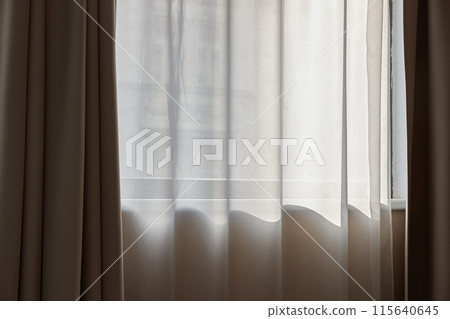Window curtain in a plain hotel room Window curtain in a plain hotel room 115640645