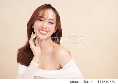 Beautiful young asian woman with clean fresh skin on beige background, Face care, Facial treatment, Cosmetology, beauty and spa, Asian women portrait. Beautiful young asian woman with clean fresh skin on beige background, Face care, Facial treatment, Cosmetology, beauty and spa, Asian women portrait. 115640779