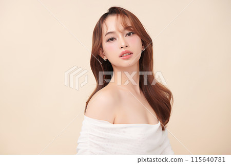Beautiful young asian woman with clean fresh skin on beige background, Face care, Facial treatment, Cosmetology, beauty and spa, Asian women portrait. 115640781
