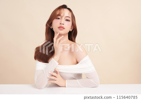 Beautiful young asian woman with clean fresh skin on beige background, Face care, Facial treatment, Cosmetology, beauty and spa, Asian women portrait. 115640785