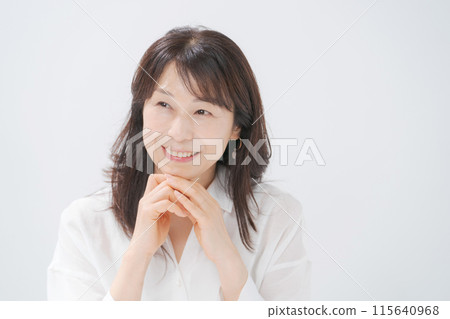 Middle-aged woman smiling and happy Middle-aged woman smiling and happy 115640968