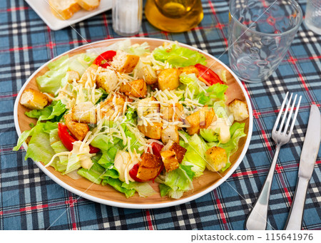 Popular dish of american cuisine is Caesar salad 115641976