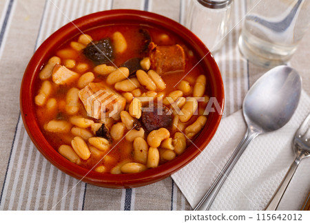 Tasty stew of asturian beans in gravy with sausages Tasty stew of asturian beans in gravy with sausages 115642012