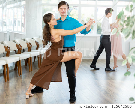 Tango performed by young couple in choreographic studio 115642596