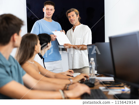 Teacher presents diploma Teacher presents diploma 115642914