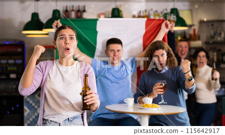 Happy fans celebrating the victory of Italian team in bar Happy fans celebrating the victory of Italian team in bar 115642917