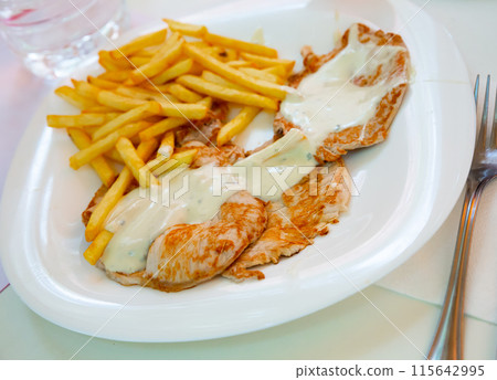 Pork steaks with fries Pork steaks with fries 115642995