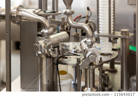 Closeup of milking facility on modern dairy farm Closeup of milking facility on modern dairy farm 115643017