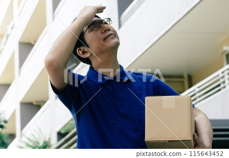 Male carrying baggage 115643452