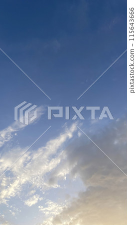 The Mesmerizing Dance of Dramatic Clouds in the Sky at Dawn's Early Hours.The Dramatic Movement of Clouds in the Sky During the Early Hours of Dawn. 115643666