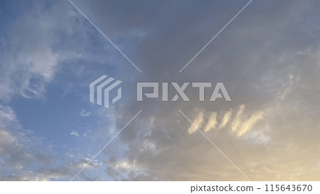 The Mesmerizing Dance of Dramatic Clouds in the Sky at Dawn's Early Hours.The Dramatic Movement of Clouds in the Sky During the Early Hours of Dawn. 115643670