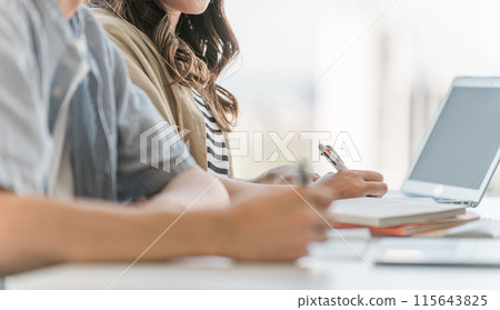 Hands of university students, businessmen, and businesswomen attending lectures, classes, training, and seminars 115643825