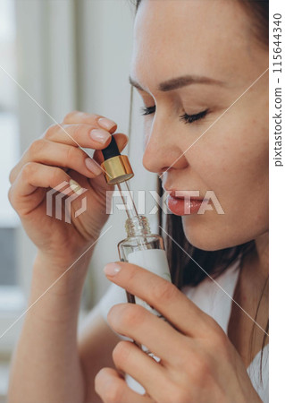 Cosmetologist esthetician performs skin treatment and rejuvenation Cosmetologist esthetician performs skin treatment and rejuvenation 115644340