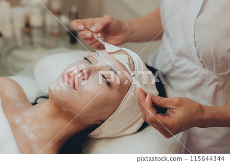woman at the cosmetologist. She has problem skin and acne. woman at the cosmetologist. She has problem skin and acne. 115644344