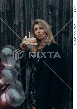 girl with cake and balloons celebrates her birthday girl with cake and balloons celebrates her birthday 115644752