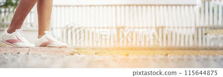 Banner Woman traveller walking on road relaxation. Women wear sneaker shoes walking summer park. Females standing green park on forest pathway outdoors. Traveler relaxing walk way with copy space Banner Woman traveller walking on road relaxation. Women wear sneaker shoes walking summer park. Females standing green park on forest pathway outdoors. Traveler relaxing walk way with copy space 115644875