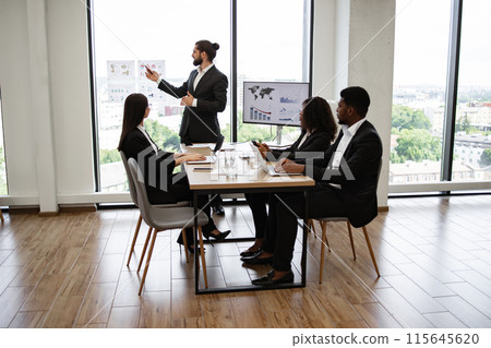 Business presentation with multiracial team in modern office 115645620