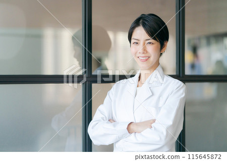 A woman in her white arm wearing her arms A woman in her white arm wearing her arms 115645872