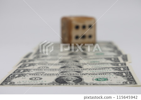 Road from dollar bills and homemade dice isolated on white background, unpredictability of financial Road from dollar bills and homemade dice isolated on white background, unpredictability of financial 115645942