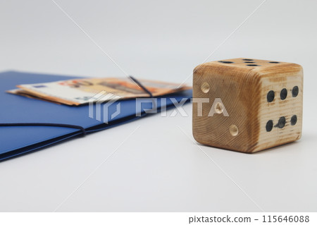 Wooden model cube on the background of banknotes. 115646088