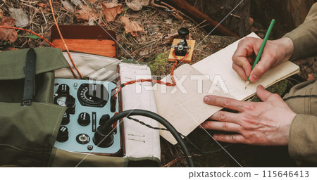 Russian Soviet Infantry Red Army Soldier In World War II using Russian Soviet Portable Radio Transceiver In Trench Entrenchment In Spring Autumn Forest. . Headphones And Telegraph Key. Close Up Hands Russian Soviet Infantry Red Army Soldier In World War II using Russian Soviet Portable Radio Transceiver In Trench Entrenchment In Spring Autumn Forest. . Headphones And Telegraph Key. Close Up Hands 115646413