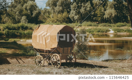 Close-up view on Russian Soviet World War Ii Peasant Cart On River Bank. Wwii Equipment Of Red Army. Historical Re-enactment 115646425