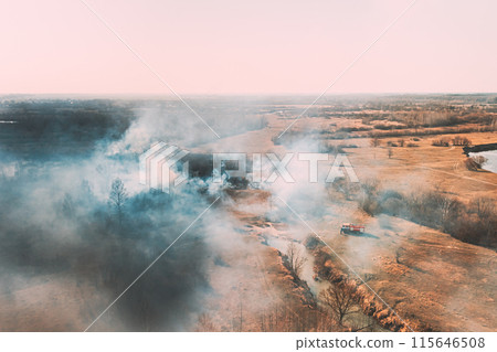 Nature In Danger. Wild Open Fire Destroys Grass. Natural Disaster. Firefighters Put Out Fire. Aerial View Of Dry Grass Burns During Drought And Hot Weather. Bush Fire And Smoke In Meadow Field Nature In Danger. Wild Open Fire Destroys Grass. Natural Disaster. Firefighters Put Out Fire. Aerial View Of Dry Grass Burns During Drought And Hot Weather. Bush Fire And Smoke In Meadow Field 115646508