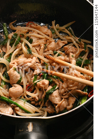 Pork chive bean sprouts being cooked 115647144