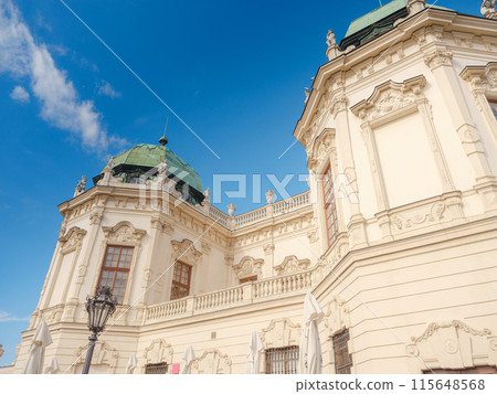 Wien, Austria - July 28, 2023: Belvedere Palace in summer sunny day. Baroque beautiful facade with statues and bas-reliefs of Lower Belvedere. 115648568