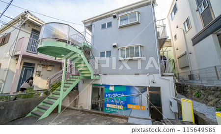 The exterior of a wooden apartment building for women The exterior of a wooden apartment building for women 115649585