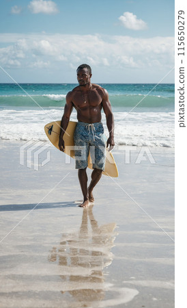 Young African American male surfer with surfboard on sandy coast near ocean 115650279