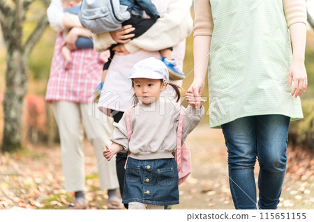 Children enjoying an autumn field trip at a nursery school or kindergarten event 115651155
