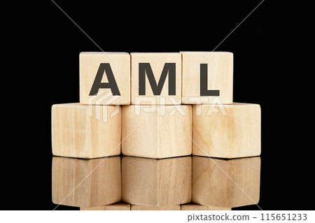 Business concept. AML word is made up of wooden cubes on a black background Business concept. AML word is made up of wooden cubes on a black background 115651233