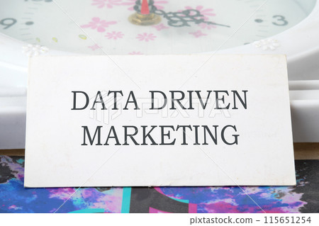 Business concept. Data driven marketing text on a white card Business concept. Data driven marketing text on a white card 115651254