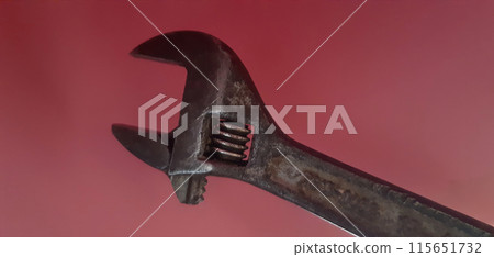 Compact, retractable key on a pink background. Steel, sliding key from 0 to 19 mm.  115651732